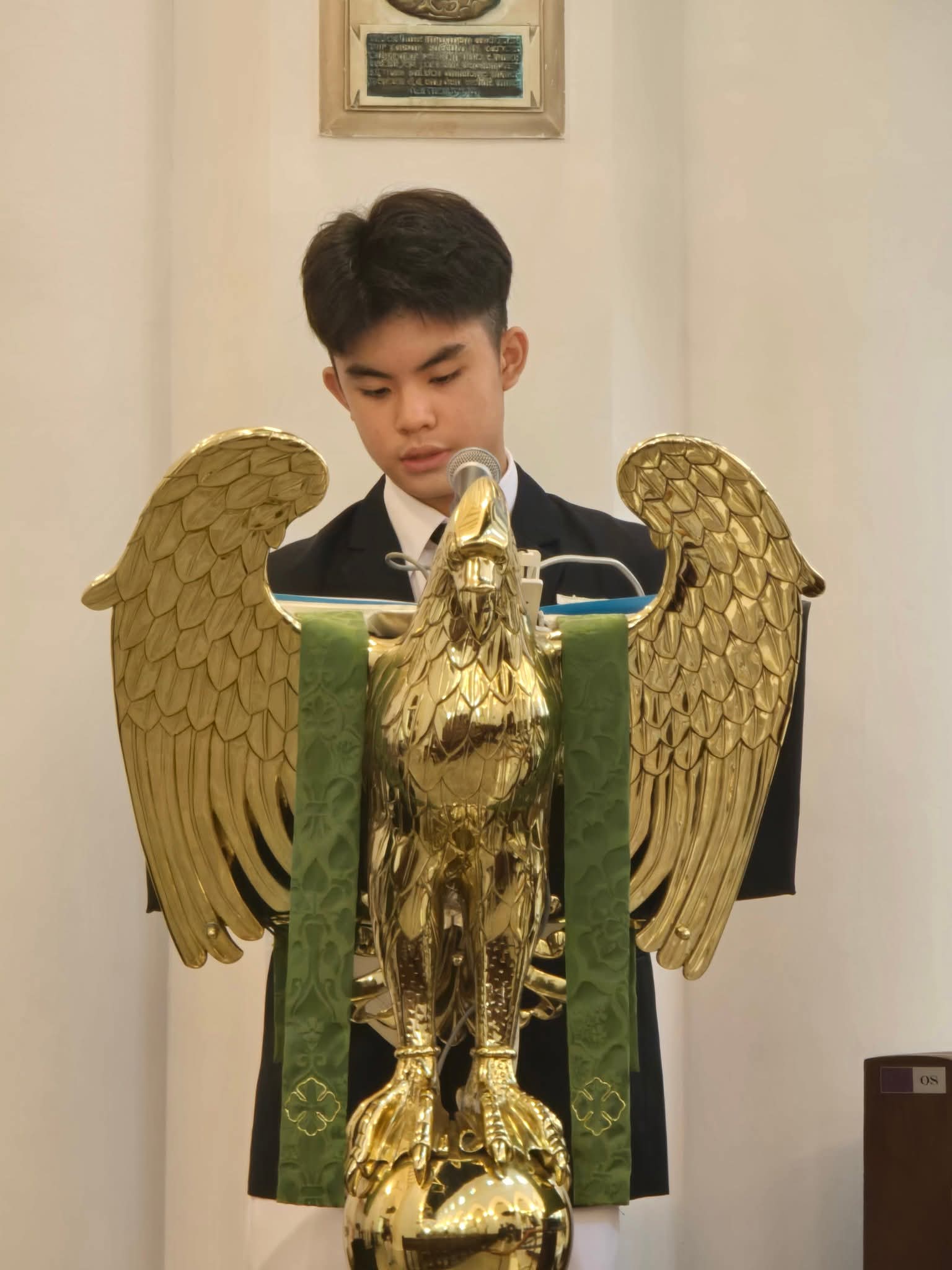 Linus as School Captain at the St Andrew's eagle lectern